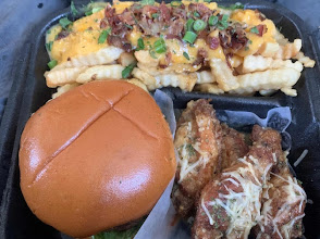 Big Meechie's signature burger, wings and fries